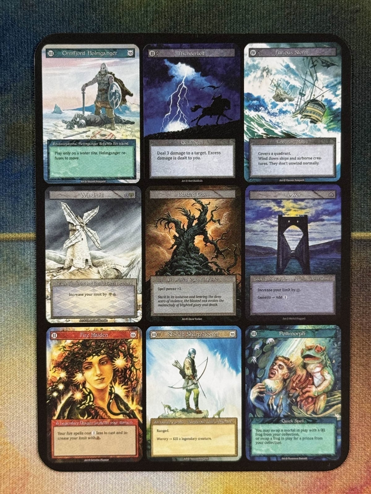 The Alpha 9-Piece Collage Curio card — nine pre-production designs in one frame